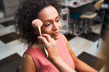 Cute curly haired woman being in her thoughts / Photodune, Misc