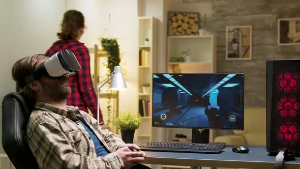 Man Sitting on Gaming Chair Playing Video Games