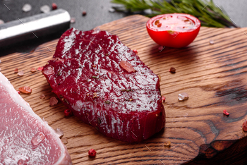 Raw fresh marbled meat Steak on a dark background / Photodune, Misc
