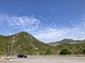 car with travelers driving on mountain highway - PhotoDune Item for Sale