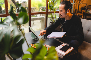 young man person using computer laptop or tablet for work and learning online / Photodune, Misc