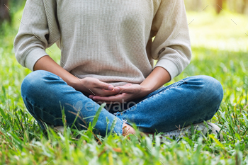 Closeup image of a woman meditating in nature / Photodune, Misc