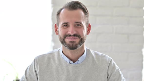 Portrait of Happy Young Architect Smiling at Camera 