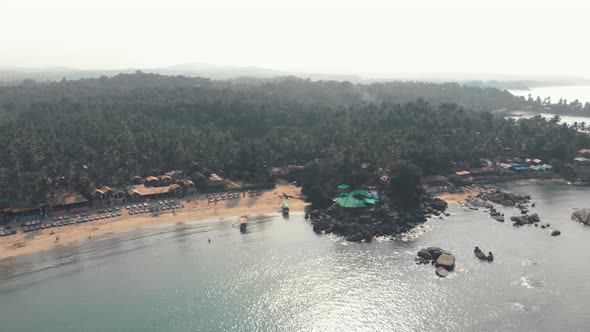 Beautiful Palolem beach landscape aerial view. Goa state, India. Orbit shot