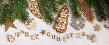 Merry Christmas written with wooden letters, cookies and Christmas decorations / Photodune, Misc