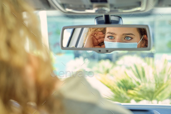 Crop woman in sterile mask against automobile mirror / Photodune, Misc