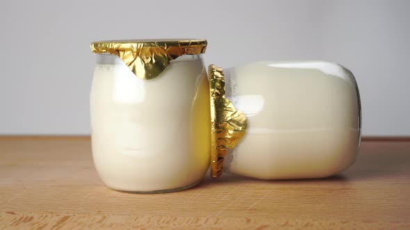 Jars with live natural yogurt with lactobacilli and probiotics 