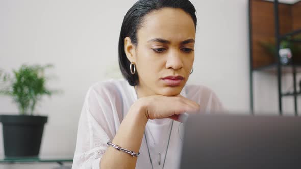 Close Up Portrait of Mixed Race Girl Working in Coworking Space or Remotely From Home