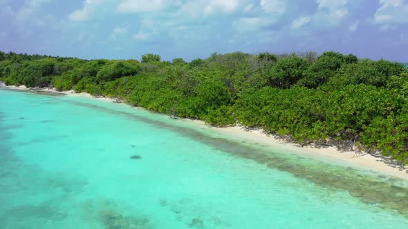 Aerial flying over travel of idyllic coast beach lifestyle by aqua blue lagoon and white sandy backg