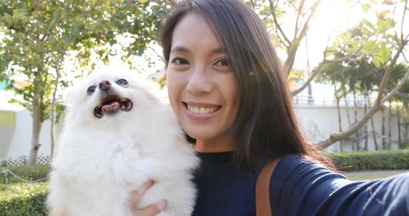 Woman being with her dog in the park