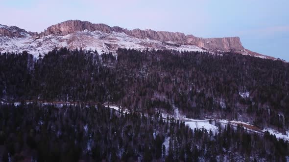 View of the beautiful snow-capped mountains on a winter day. Drone camera.