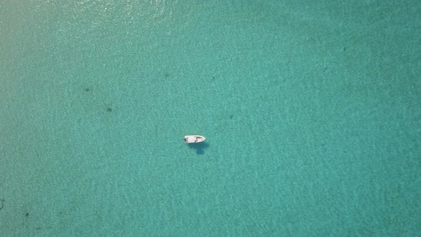 Aerial drone view of a fishing motor boat in the Bahamas, Caribbean. 