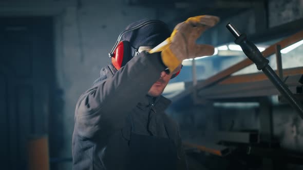 Portrait Shot of a Tired Factory Worker