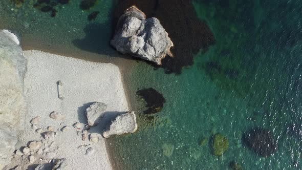 Aerial View on Calm Azure Sea and Volcanic Rocky Shores