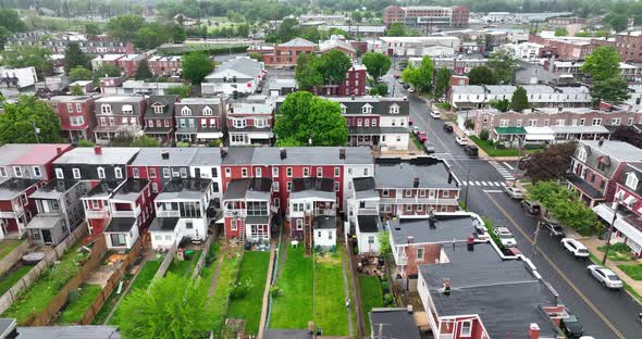 Aerial truck shot of city houses. Wet, rainy spring day in Pennsylvania, USA. Drone view of city sub