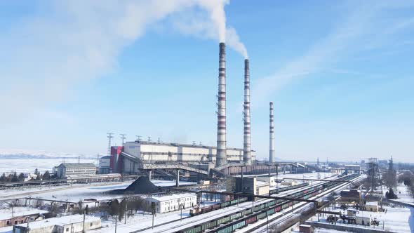 Aerial view of old thermoelectric plant with big chimneys in a rural landscape