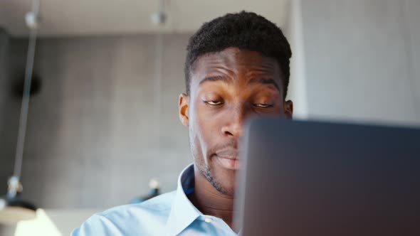 Young male communicating by videoconference