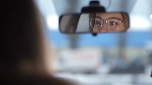 Shooting in the Car Reflected in the Front Mirror