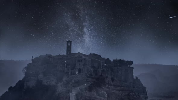 Milky way over old town of Bagnoregio, Italy. Timelapse.