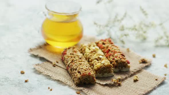 Delicious Cereal Bars and Honey in Jar