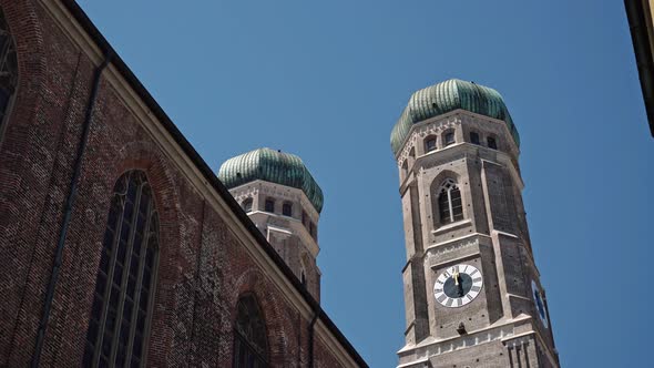 Pan Real Time Shot of the Domes of the Church of Our Lady, Frauenkirche, Munich, Germany.