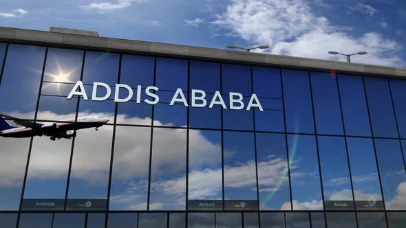 Airplane landing at Addis Ababa Ethiopia airport mirrored in terminal