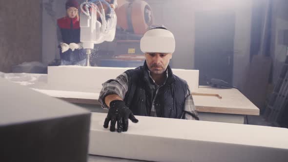 Man with VR Headset Examining Polymer Block