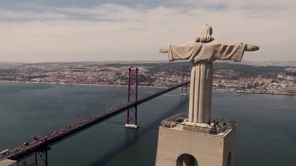 Christ the King, symbol of peace overlooking Lisbon capital city, aerial shot.