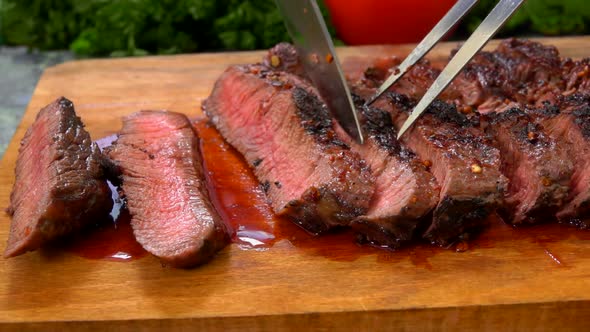 The Chef Turns the Prepared Super Juicy Steak on a Wooden Board