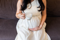 Pregnant woman with cup of milk - PhotoDune Item for Sale
