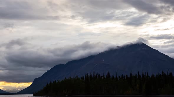 Time Lapse, Beautiful View of Canadian Nature of Lake, Mountains and Trees. Cloudy Sunset. Kathleen Lake, Kluane National Park, Yukon, Canada