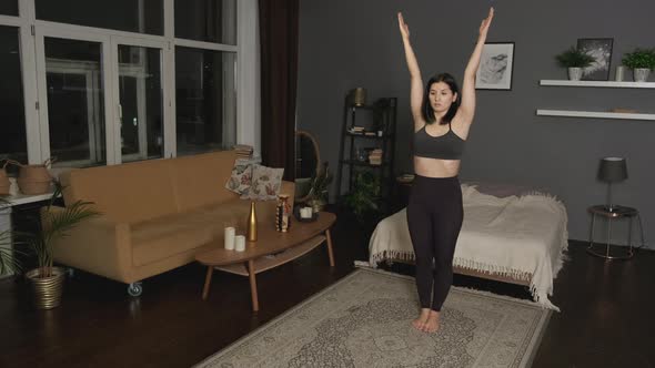 Young Asian Woman doing balance exercise and Stretching sports Yoga, Black Sportswear Leggings 