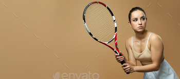 ooking away with serious expression. Isolated on beige background