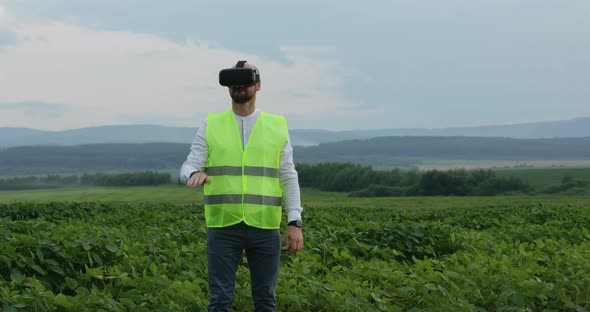 Farm Specialist Engineer Using Technology VR Monitoring Harvest Working for Agriculture Productivity