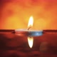 A small candle floating in the wavy water in the darkness - VideoHive Item for Sale