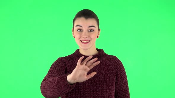 Happy Woman Waving Hand and Showing Gesture Come Here. Green Screen