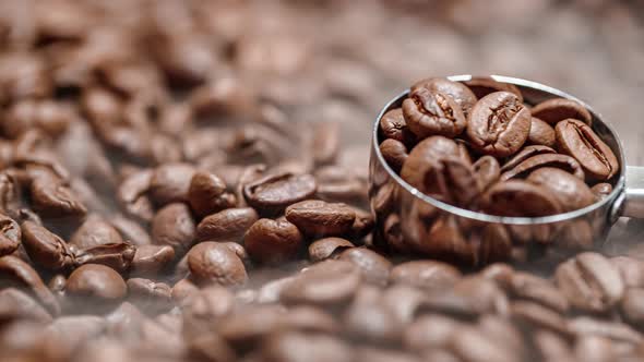 Close Up of Seeds of Coffee. Fragrant Coffee Beans Are Roasted Smoke Comes From Coffee Beans