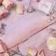 Hand puts WEDDING card on a marble table near pink flowers close up - VideoHive Item for Sale