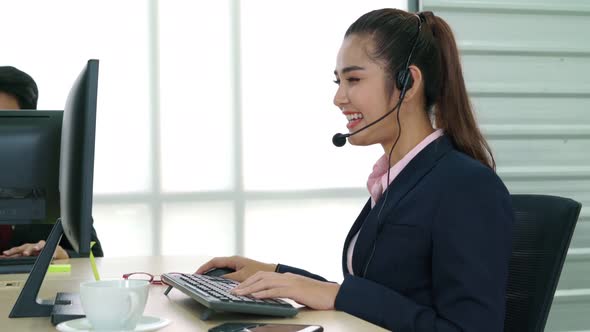 Business People Wearing Headset Working in Office