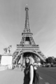 Woman in front of the Eiffel tower in Paris - PhotoDune Item for Sale