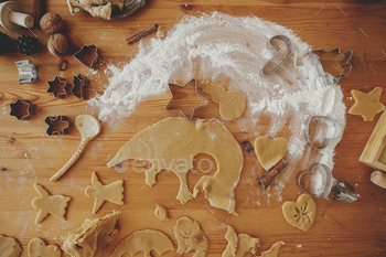Making christmas cookies, flat lay. Gingerbread dough, cutters, spices, flour on wooden table / Photodune, Misc