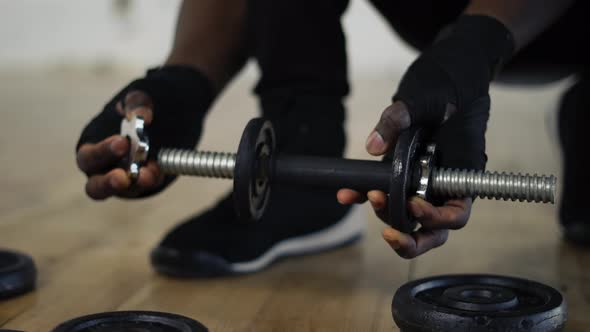 Adding Weight on a Dumbbell and Screwing It on
