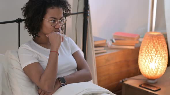 Pensive African Woman Thinking in Bed