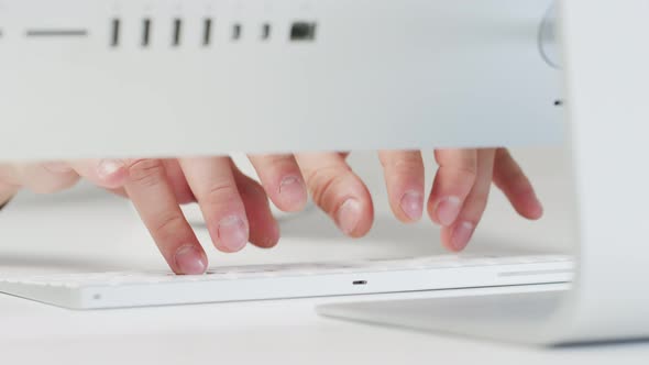 Fingers typing on keyboard