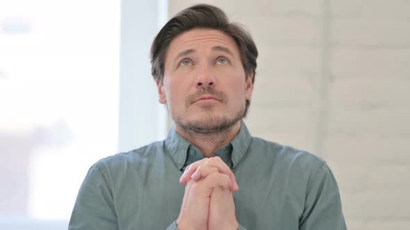 Praying Middle Aged Man