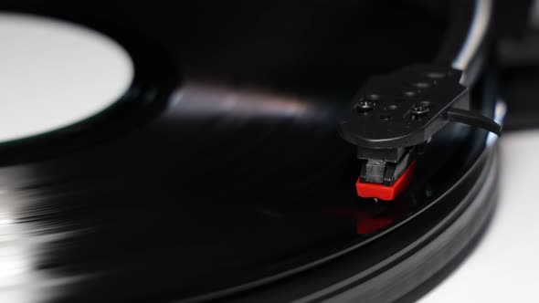 Vinyl turntable with vinyl plate. Gramophone record player. Retro sound technology to play music