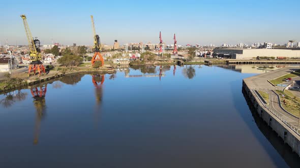 Imposing industrial container cranes next to Riachuelo River; La Boca, Buenos Aires