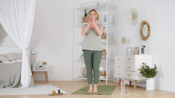 Yoga Trainer Getting Ready for Online Yoga Lesson