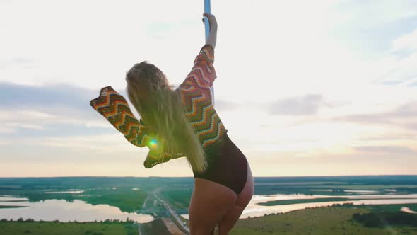Pole Dance on Nature - Woman in Swimsuit and Colorful Knitted Crop Top Dancing on the Top of Dancing