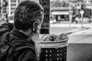 Grayscale photo of man throwing trash / Photodune, Misc